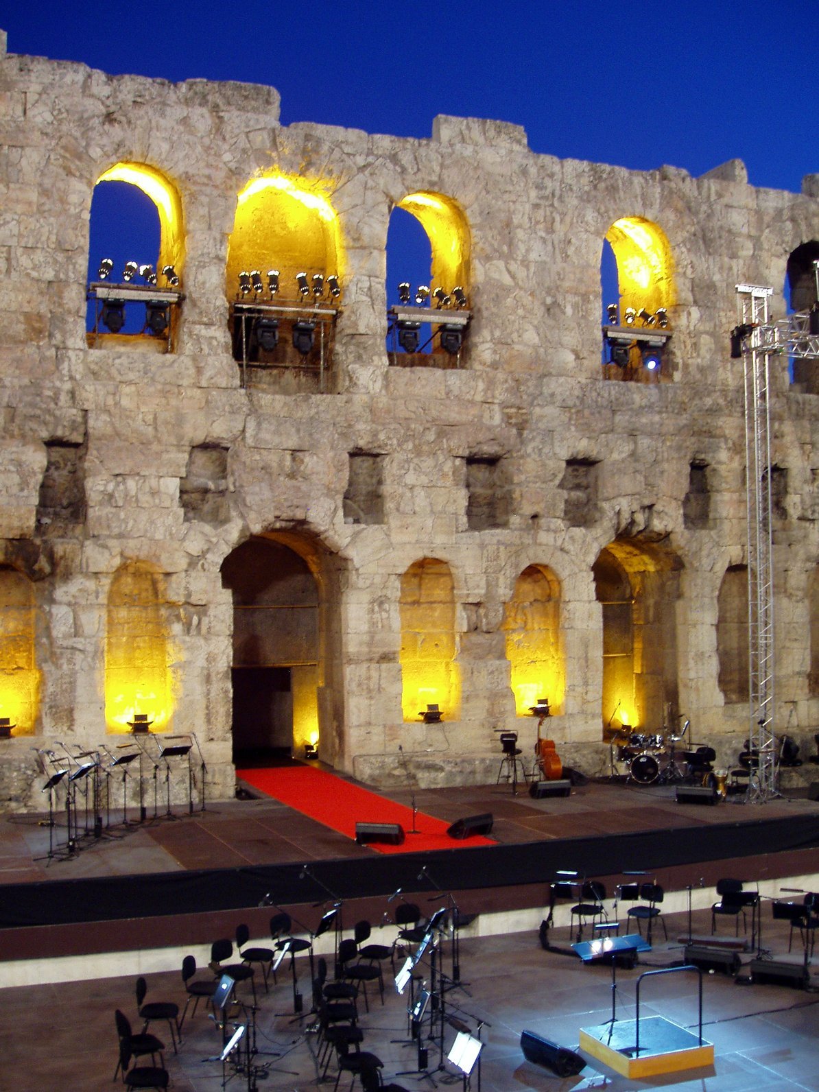 Ancient stone amphitheater, lit for performance