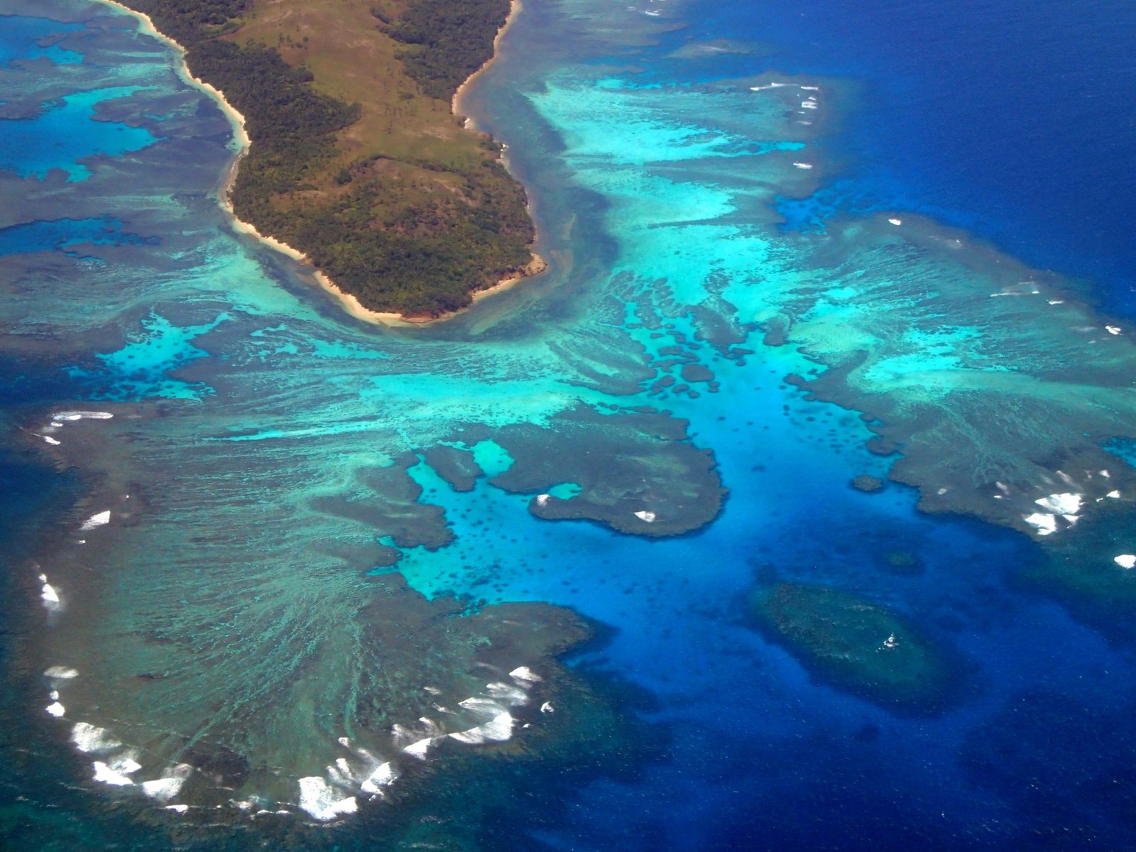 Aerial of a Tongan reef and coastline